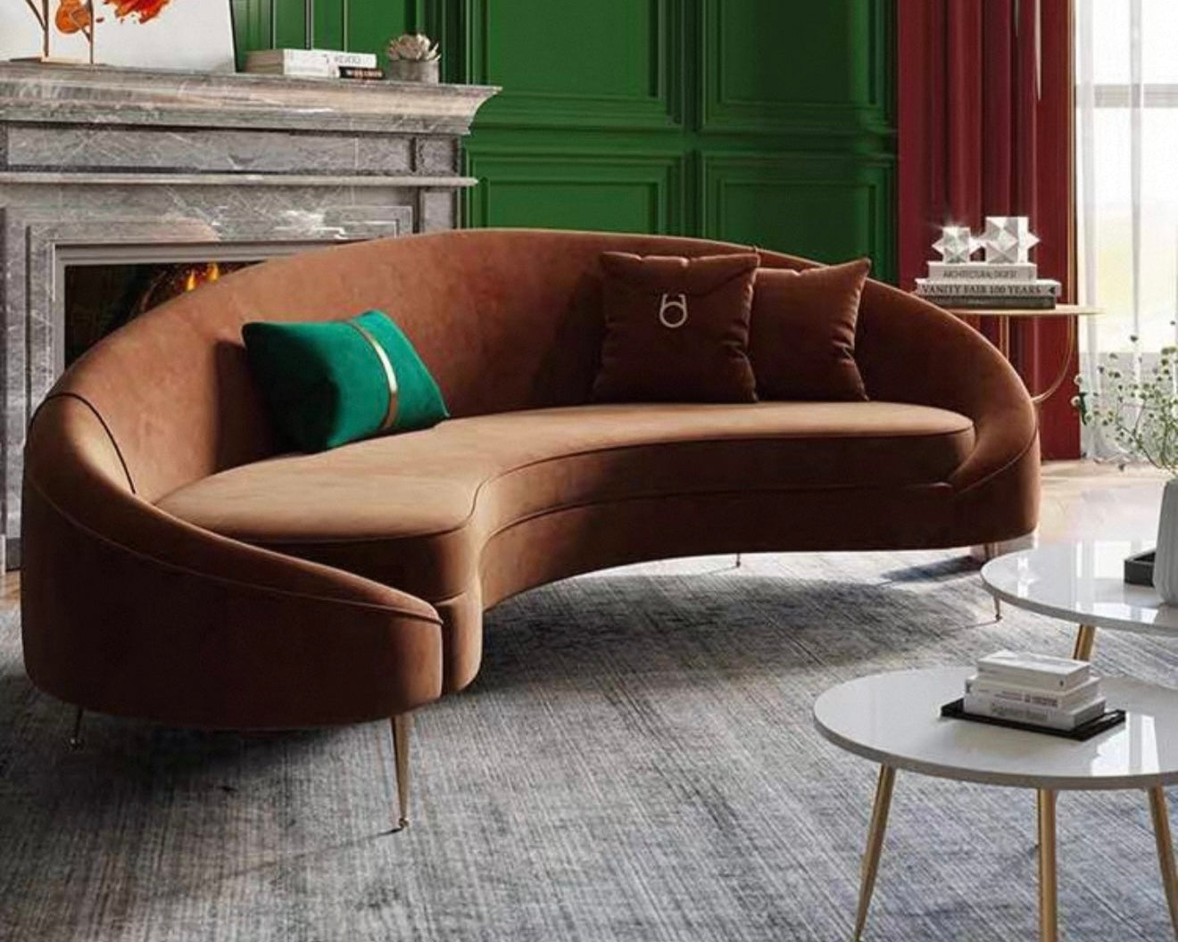 Brown curved sofa in a stylish living room with green walls and a fireplace.
