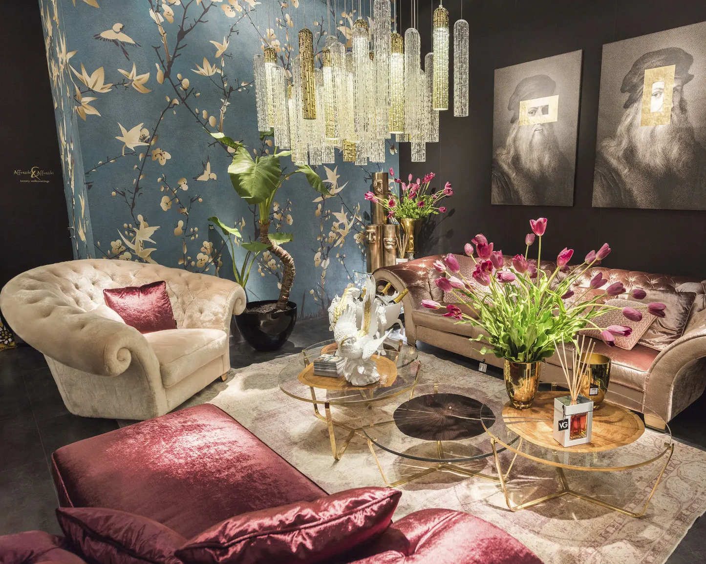 Luxurious living room with ornate furniture, decorative wall art, and floral arrangements.
