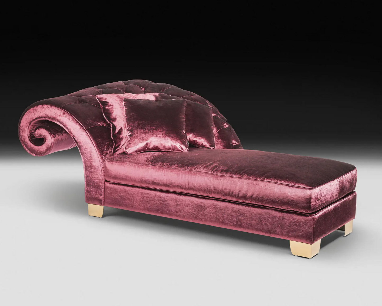 Pink velvet chaise lounge on a gray background