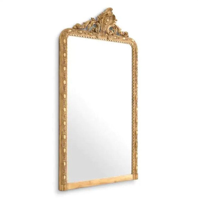 Decorative gold-framed mirror on a white background