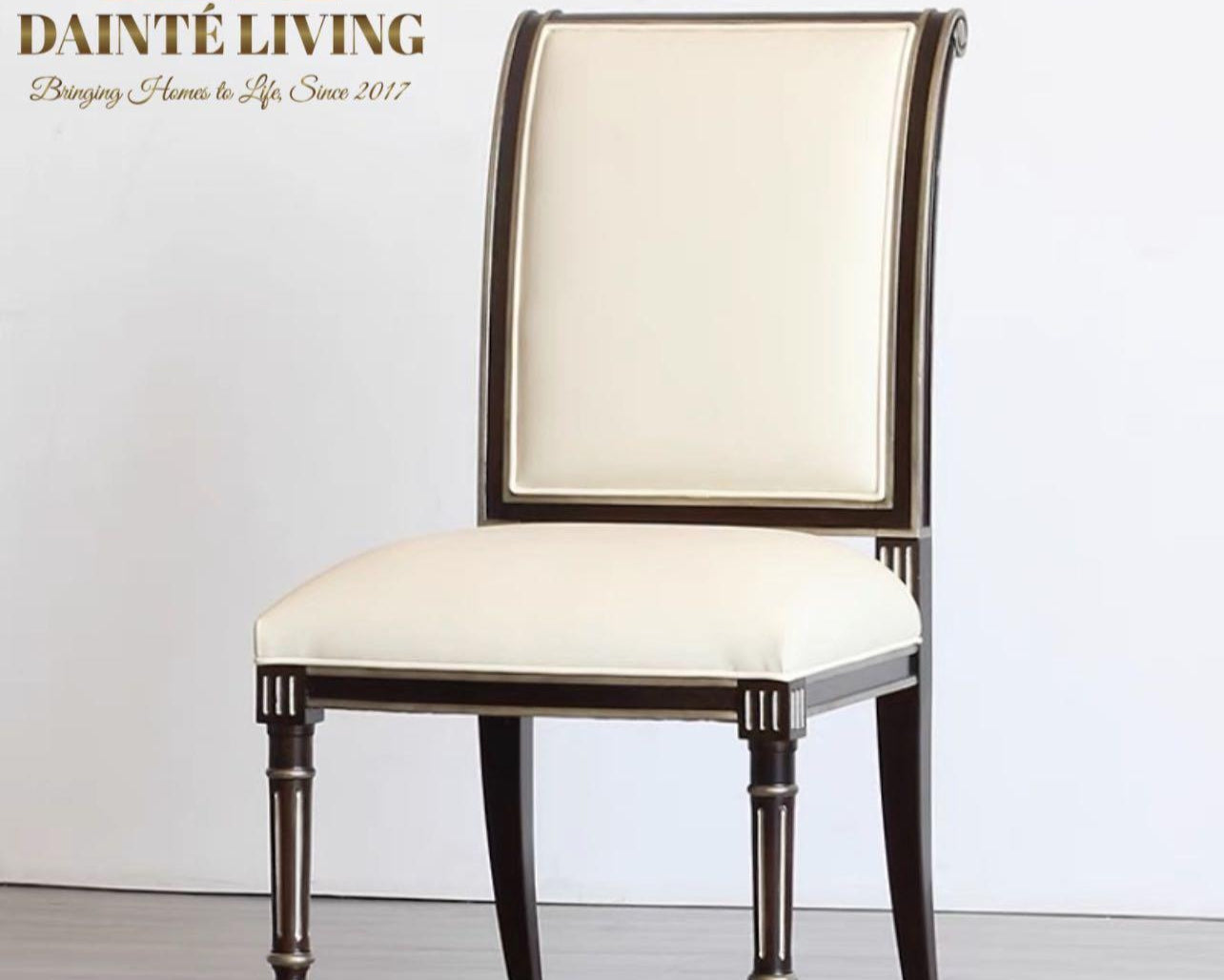 A luxury style dining chair with beige upholstery and dark wood frame and legs.