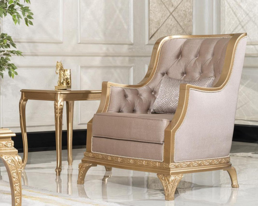 An elegant mahogany wood rococo armchair with upholstery in a soft color, featuring tufted backrest and seat, with a matching ottoman.