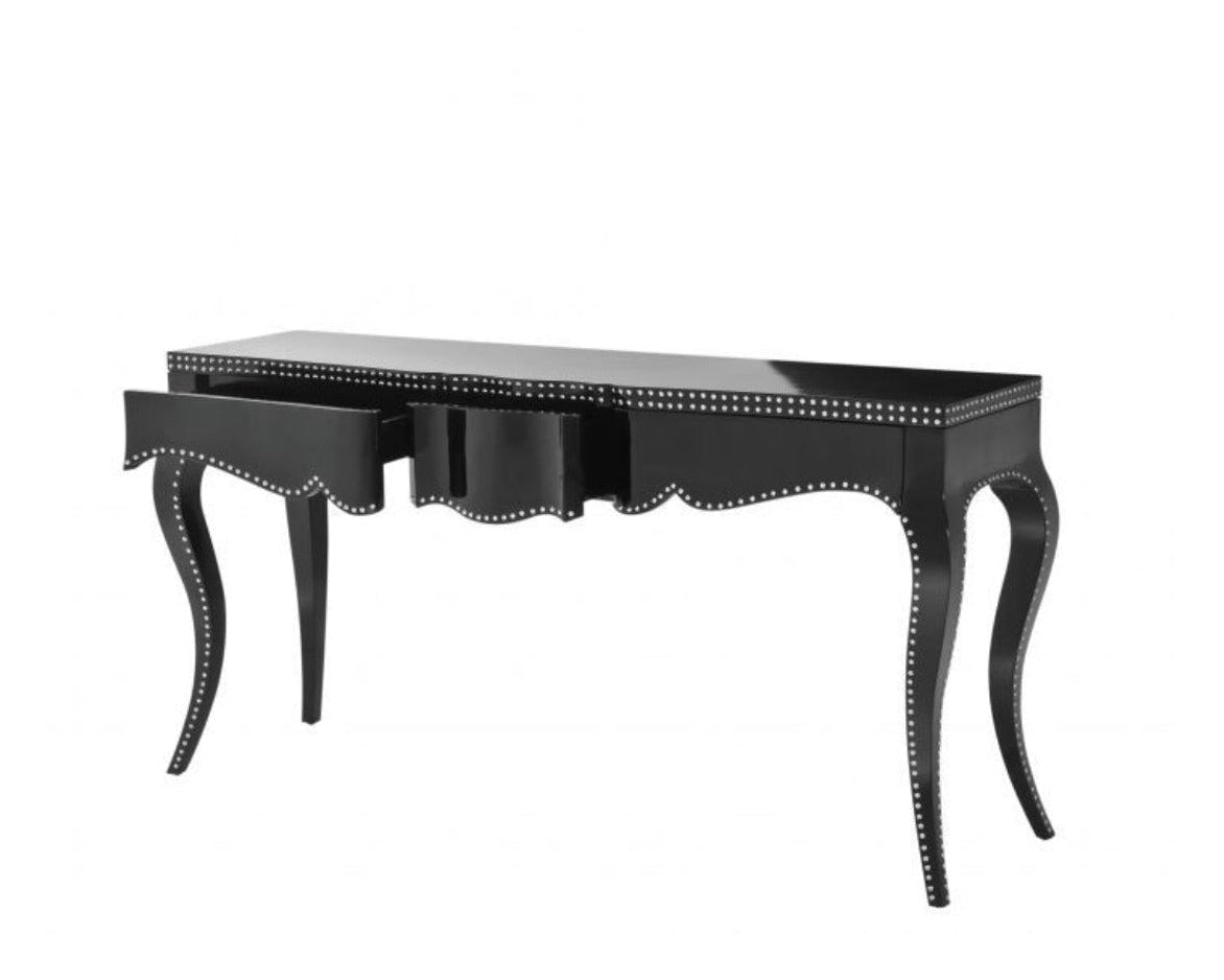 Black desk with decorative nailhead trim on a white background
