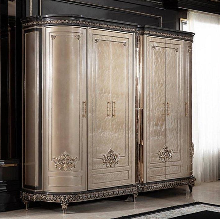 A luxurious French style wooden wardrobe with intricate details and a champagne finish, featuring gold accents.