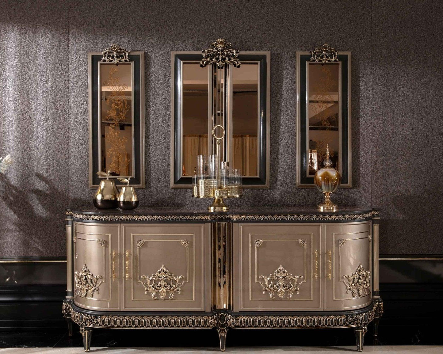 An ornate French Luxe buffet cabinet with mirrored panels and intricate carvings, finished in champagne gold, set against a dark background.