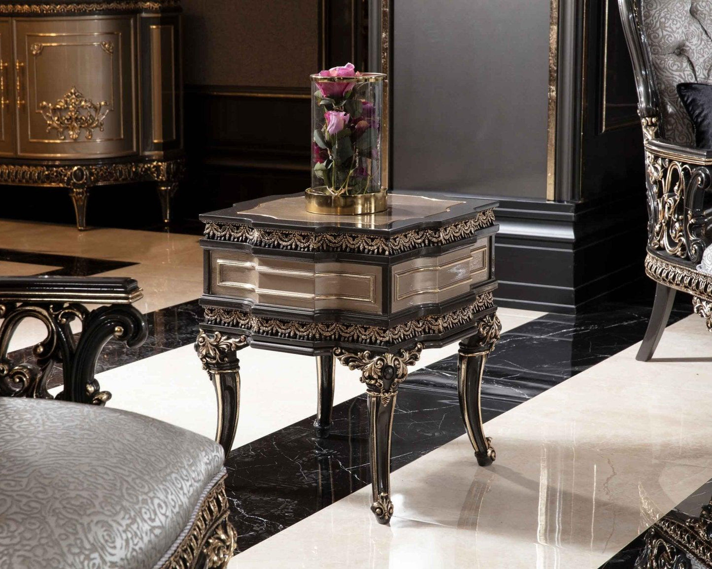 A luxurious French side table with gold details, hand-carved in mahogany wood, with an embossed fabric top, displayed in an ornate room setting.