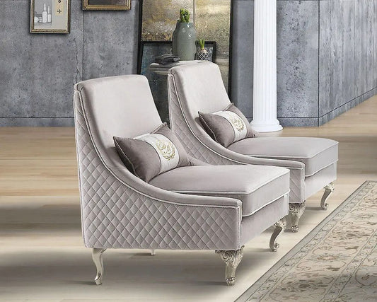 Gray quilted armchair and chaise lounge in a stylish room with decorative elements.