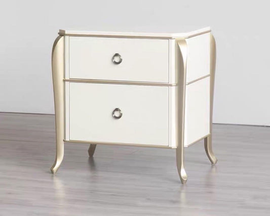 A modern luxury style nightstand with two drawers, featuring a white frame with gold accents and a sleek design.