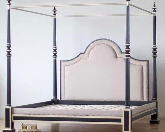 A luxury style bed frame with a beige upholstered headboard and footboard, and dark wood posts.