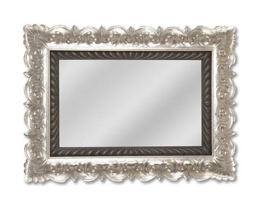 Decorative mirror with an ornate silver frame on a white background