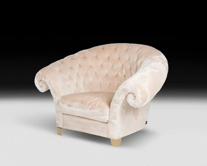 Beige armchair with tufted backrest on a white background