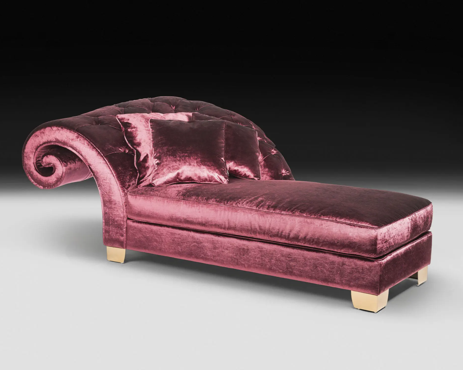 Pink velvet chaise lounge on a gray background