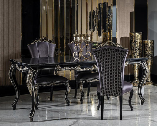 Dining room with black and gold furniture, including a table and chairs.