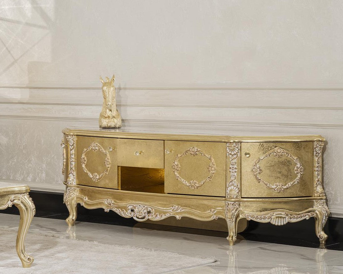 Gold ornate cabinet with decorative elements in a room with white walls and marble floor.
