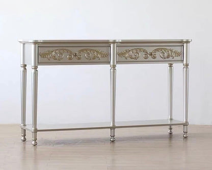 Decorative console table with ornate designs on a plain background
