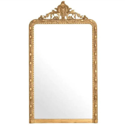 Decorative gold-framed mirror on a white background