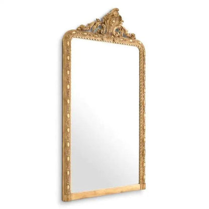 Decorative gold-framed mirror on a white background