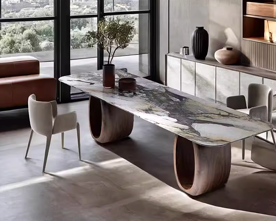 Modern dining table with marble-like surface and wooden base in a stylish room.