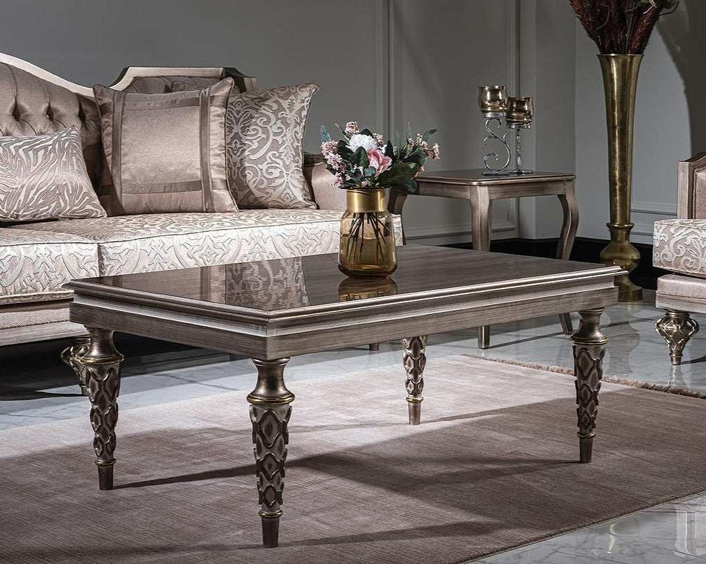 Decorative living room with a coffee table, sofa, and decorative items.