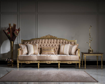Luxurious sofa with decorative pillows in a room with a gray wall and decorative elements.