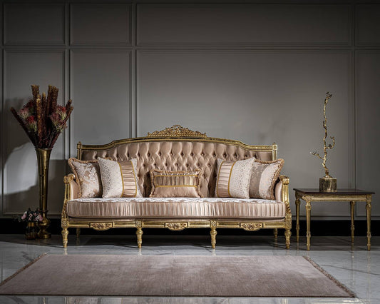 Luxurious sofa with decorative pillows in a room with a gray wall and decorative elements.