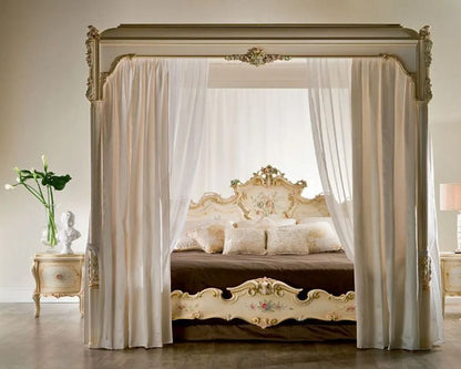 Luxurious bedroom with a canopy bed, ornate furniture, and decorative elements.