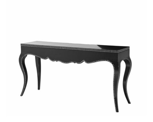 Black console table with decorative nailhead trim on a white background