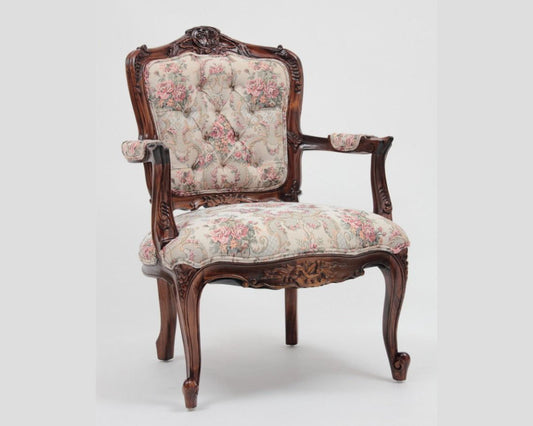 Vintage Victorian armchair with floral pattern and tufted back rest