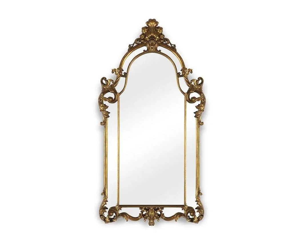 Decorative gold-framed mirror on a white background