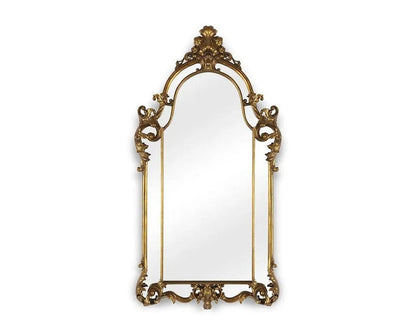 Decorative gold-framed mirror on a white background