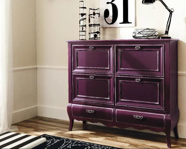 Amethyst Shoes and Footwear Console Cabinet shoe cabinet with decorative items against a white wall