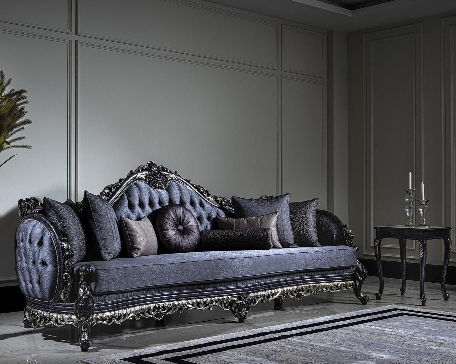 Decorative sofa with ornate detailing in a room with a candlestick holder and vase.
