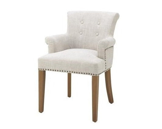 White upholstered chair with wooden legs on a white background