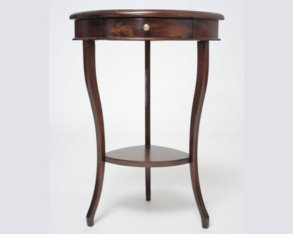 Wooden side table with a round top and curved legs on a white background