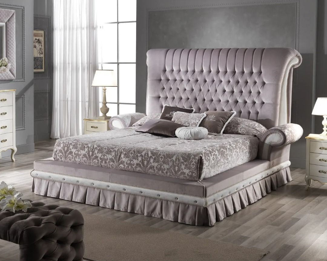 Luxurious bedroom with a tufted bed and matching headboard.