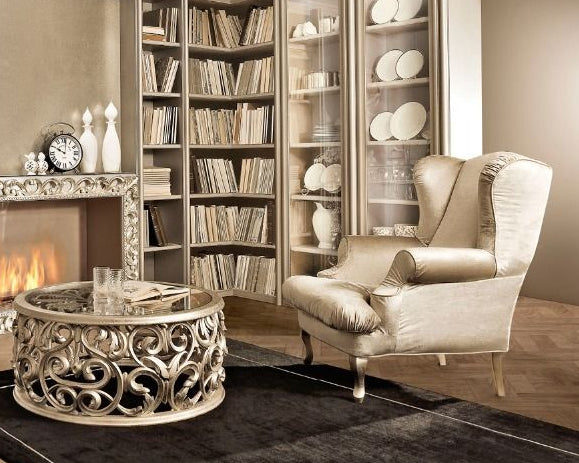 Modern living room with a fireplace, bookshelves, and decorative items.