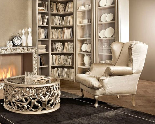 Modern living room with a fireplace, bookshelves, and decorative items.