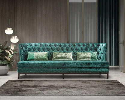 Emerald Teal cashmere crushed velvet sofa with decorative pillows in a modern living room setting.
