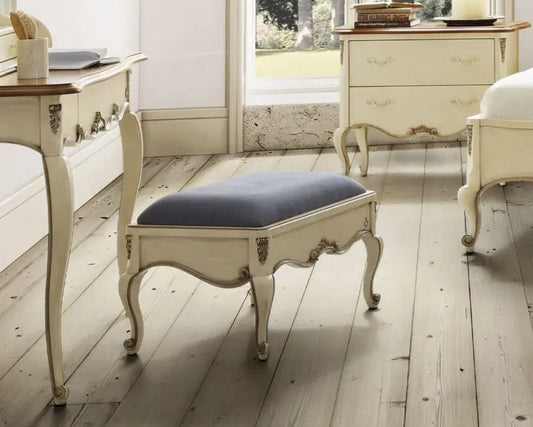 Vintage-style bedroom with a stool on a wooden floor