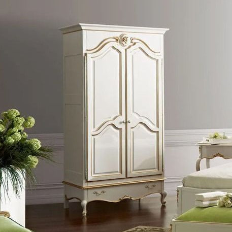 Luxurious bedroom with green headboard and matching ottoman, white wardrobe, and large window.