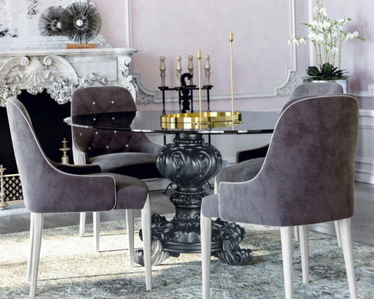 Baroque dining table with glass marble top and intricate carving on pedestal base