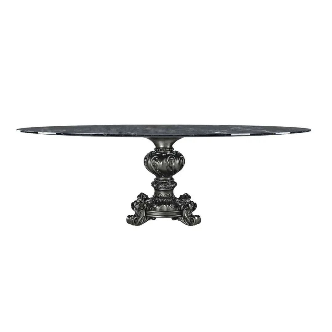 Round marble table with decorative pedestal base on a white background