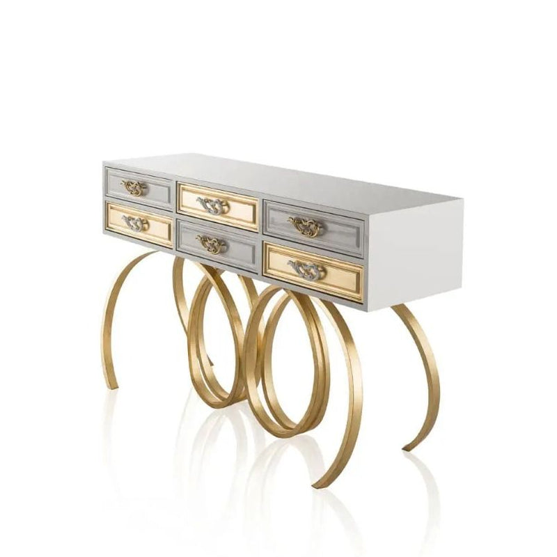 Console table with gold legs and white top on a white background