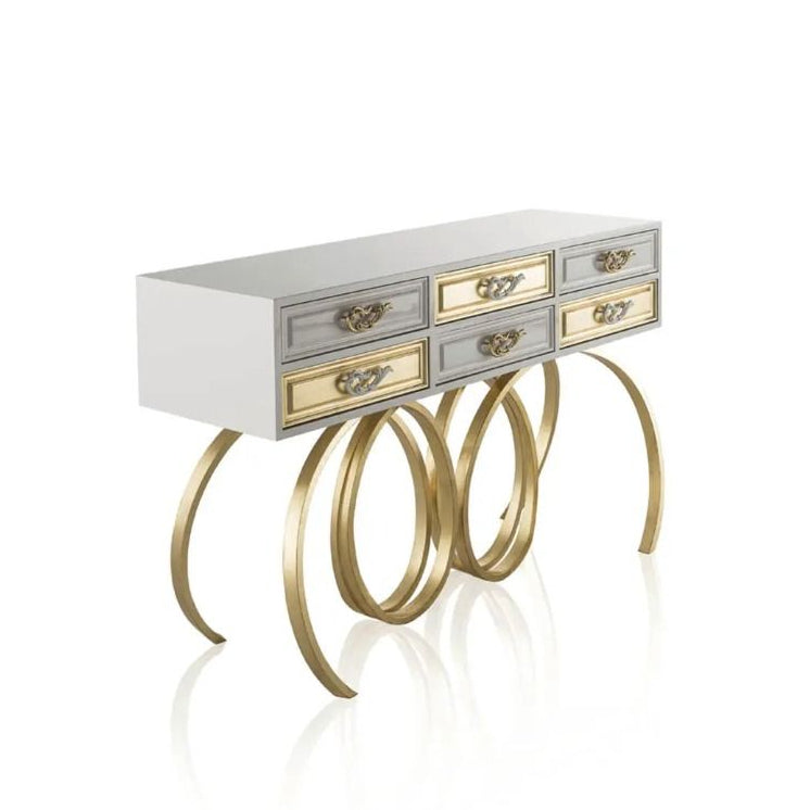 Console table with gold legs and drawers on a white background