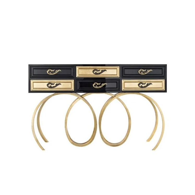 Set of gold hoop earrings with a black and gold jewelry box on a white background