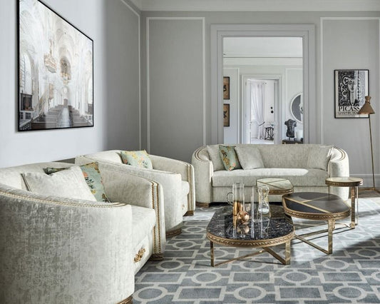 Living room with gray sofas, a coffee table, and decorative items.