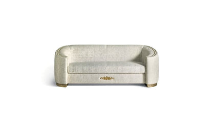 Beige sofa with a gold emblem on a white background