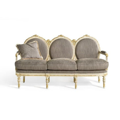 Decorative Louis XVI sofa with gold frame and gray cushions on a white background