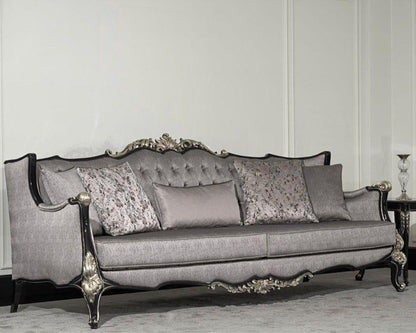 A luxurious baroque sofa with intricate carved details and a sleek lacquer finish, upholstered in gray fabric with ornate wooden frame.