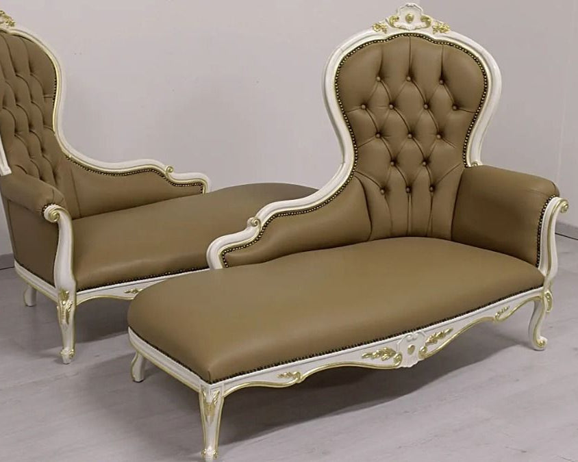 Pair of ornate brown chaise lounges with white trim on a plain background
